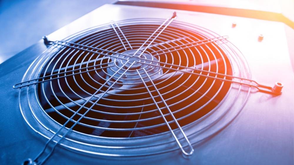 HVAC engineer servicing a heating system